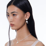 YVMIN dolphin stud earrings with heart-shaped mother-of-pearl and island-themed design, featuring shimmering dolphin and pearl accents.
