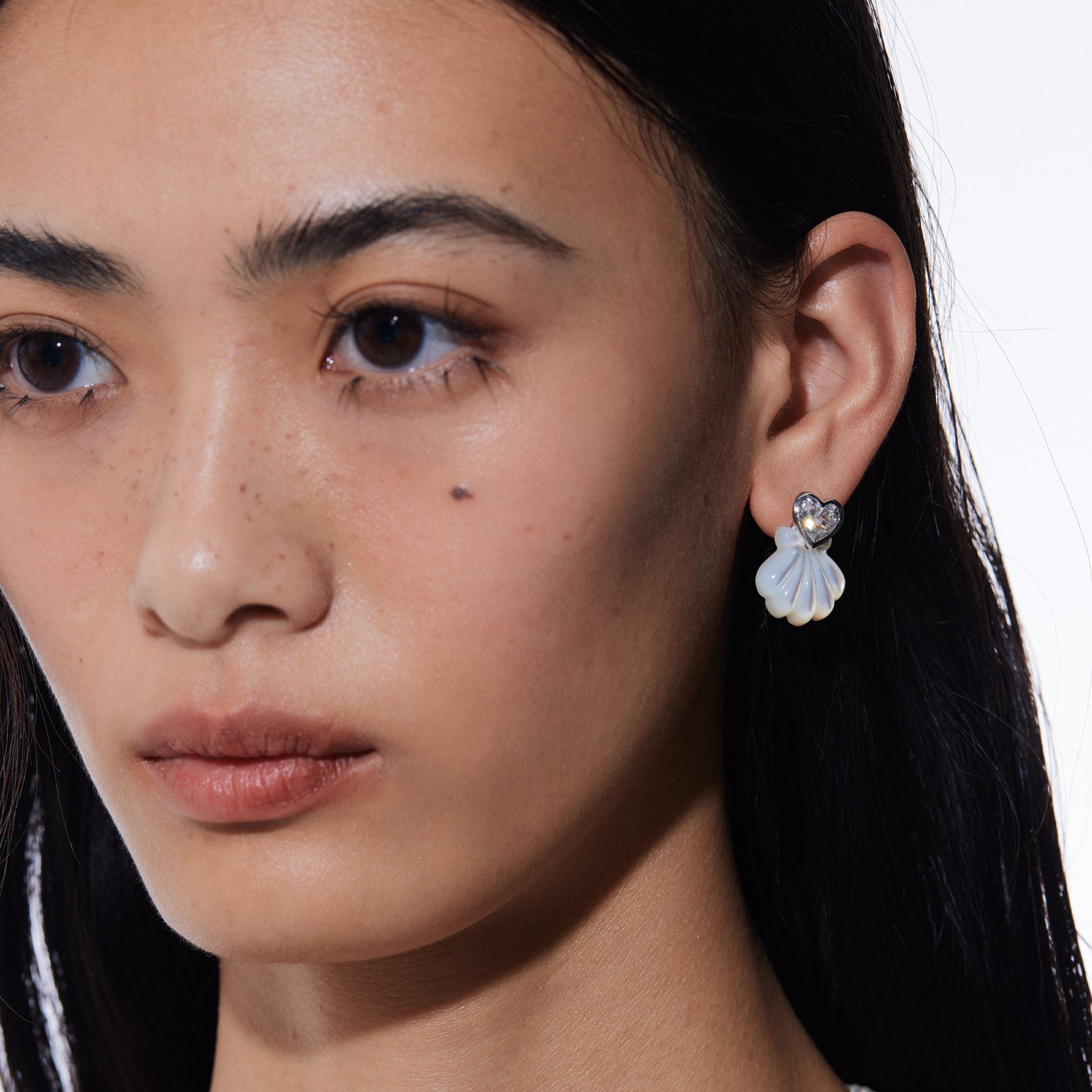 YVMIN Island and Heart Gem Carved Shell Stud Earrings showcasing intricate shell designs and gemstone accents.