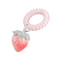 YVMIN Paradise Strawberry hair band with vibrant red and green strawberry design, perfect for adding a fun touch to hairstyles.