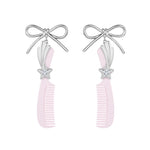 YVMIN X Ashley Williams bowknot comb earring featuring a delicate bow knot design and gold-tone finish.