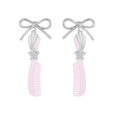 YVMIN X Ashley Williams bowknot comb earring featuring a delicate bow knot design and gold-tone finish.