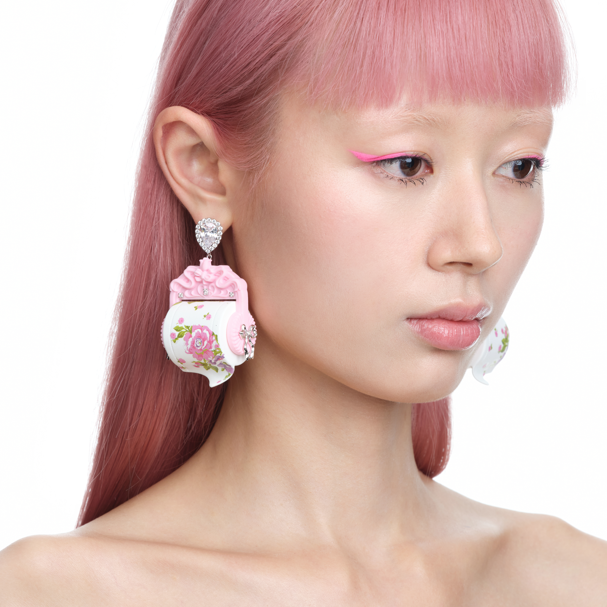 YVMIN X Ashley Williams Scroll Earrings in silver, featuring a sculptural curled design and polished finish
