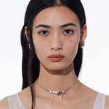 YVMIN Island Dolphin Pearl Snake Bone Necklace featuring a detailed pendant with dolphin and pearl accents on a snake chain.