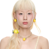 Shop YVMIN  Lemon Necklace. Iconic jewelry worn by aespa members Karina, Winter, Giselle, and Ningning. Elevate your K-pop fashion with this futuristic style.