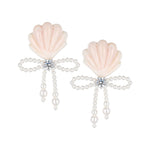 YVMIN carved shell pearl bow stud earrings with island-inspired design, featuring elegant shell and pearl details.