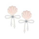 YVMIN carved shell pearl bow stud earrings with island-inspired design, featuring elegant shell and pearl details.