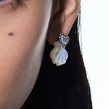 YVMIN carved shell stud earrings featuring island and heart gem designs, showcasing intricate craftsmanship and natural shell patterns.