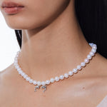 YVMIN Island double dolphin pearl necklace featuring two dolphins and pearl accents on a silver chain.