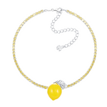 Shop YVMIN  Lemon Necklace. Iconic jewelry worn by aespa members Karina, Winter, Giselle, and Ningning. Elevate your K-pop fashion with this futuristic style.