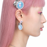 YVMIN X Ashley Williams Mourning stud earrings with dark sculptural detailing and silver-tone posts