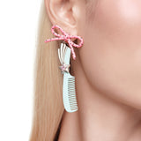 YVMIN X Ashley Williams bowknot comb earring with delicate bow design and gold-tone finish, stylish accessory for pierced ears.