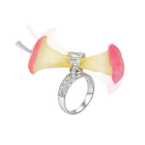 YVMIN Paradise Apple Core Spin Ring showcasing a silver-toned, intricate design with a smooth spinning feature.