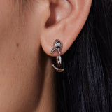 YVMIN island and interlocking dolphin stud earrings featuring silver-tone metal and detailed dolphin designs.