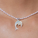 YVMIN carved mother-of-pearl dolphin necklace with natural pearl pendant, featuring intricate dolphin design and elegant craftsmanship.