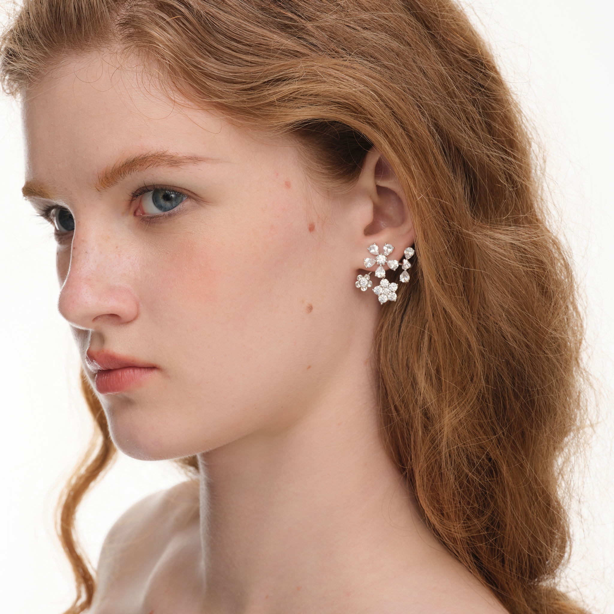 YVMIN Paradise Gem Flower Bow Stud Earrings featuring sparkling gemstone flowers and bow design on silver-tone posts