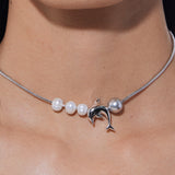 YVMIN Island Dolphin Pearl Snake Bone Necklace featuring a detailed dolphin and pearl pendant on a snake bone chain.