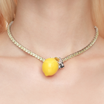 Shop YVMIN  Lemon Necklace. Iconic jewelry worn by aespa members Karina, Winter, Giselle, and Ningning. Elevate your K-pop fashion with this futuristic style.