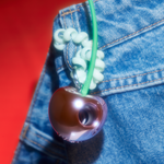 YVMIN Paradise Virtual Cherry Hair Tie worn by a model, featuring a playful cherry design on a stretchy hair accessory.