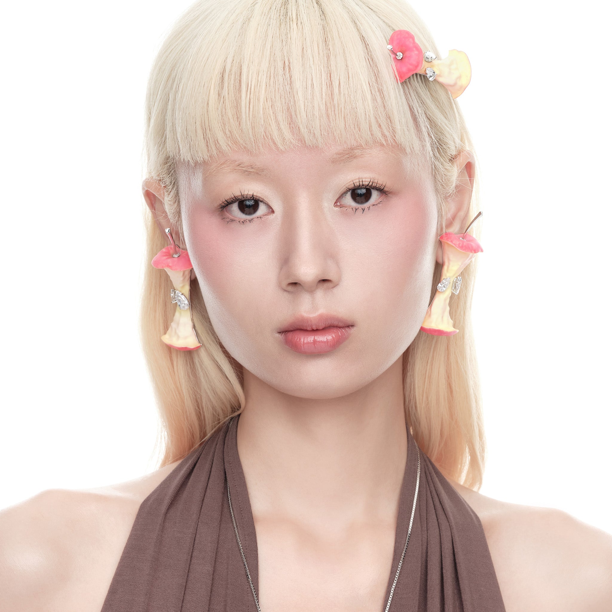 YVMIN Paradise Apple Core earring worn on model, gold-tone jewelry with a unique apple core design, stylish and elegant accessory