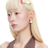 YVMIN Paradise Apple Core Earring worn by model, featuring a unique gold design with intricate detailing.