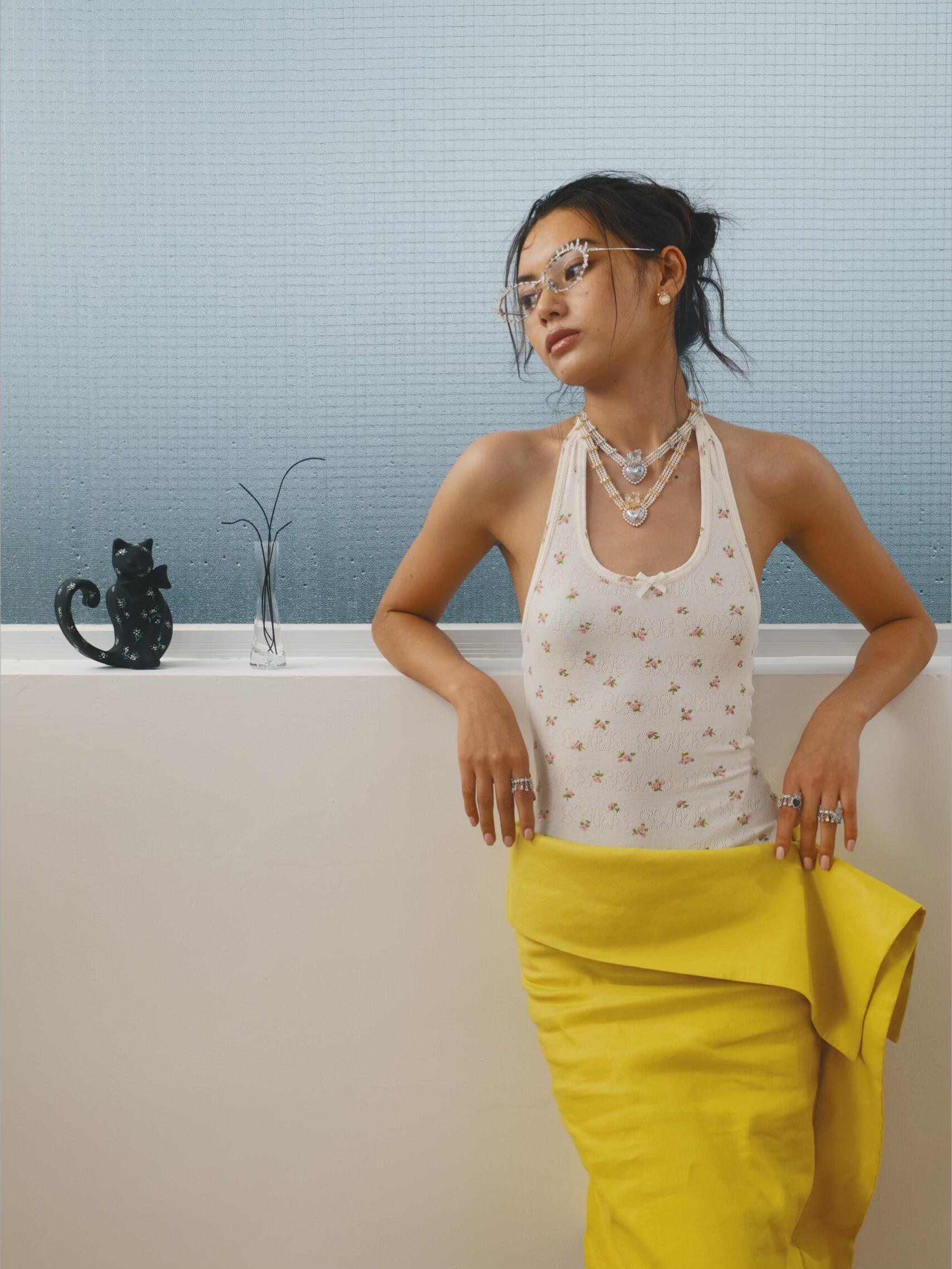 YVMIN campaign styling with layered necklaces